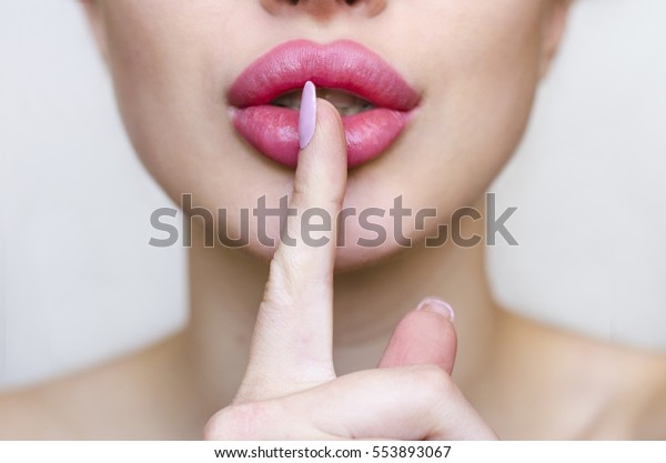 woman-pink-lipstick-finger-showing-hush-stock-photo-edit-now-553893067