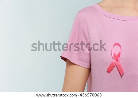 Woman with pink ribbon. Cancer concept