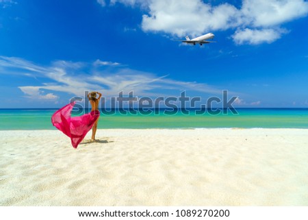 Woman with pink sarong on the tropical beach, Luxury beach travel vacation 