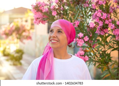 Woman With Pink Scarf On The Head. Cancer Awareness