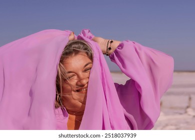 Woman Pink Scarf Salt Flats Beach Playful Portrait - Powered by Shutterstock