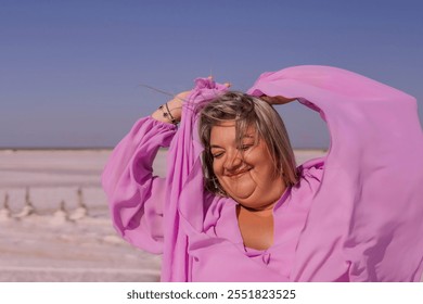 Woman, Pink Shirt, Salt Flats - Smiling woman wearing pink shirt at salt flats. - Powered by Shutterstock