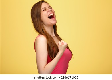 Woman In Pink T Shirt Demonstrated Her Power With Bent Arm, Standing Over Yellow Isolated Background.