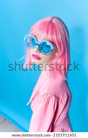 woman in pink wig posing fashion glasses
