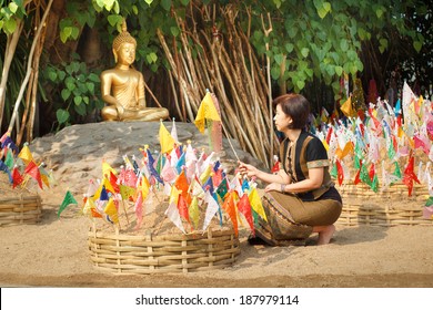 Woman Pinned Prayer Flags On Sand Pagoda At Temple In Songkran Festival ,Chiangmai Thailand.