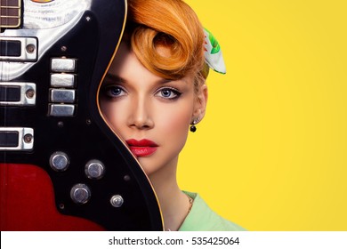 Woman Pinup Girl With Electric Acoustic Rock Guitar Isolated Yellow Background