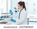 Woman, pipette and scientist with medical research, chemistry laboratory and science for pharmaceutical in Denmark. Female person, petri dish and sample in pathology, test or analysis in mpox vaccine