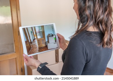 Woman Plans On Selling Her Empty Studio Apartment Taking Photo Of Interior In Custom Design Living Room On Her Smart Tablet. House Seller Giving Video Tour Around Her Home