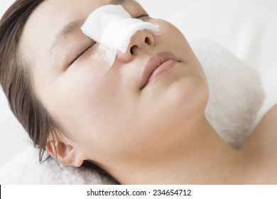 Woman with a plaster on the nose