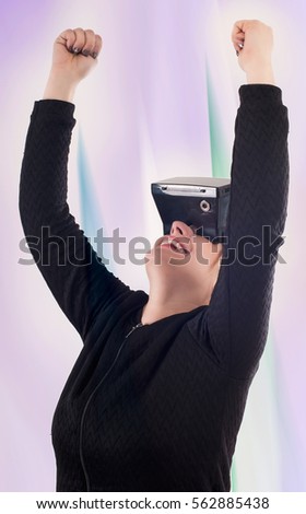 Woman play game with virtual reality device mask. Studio shoot.