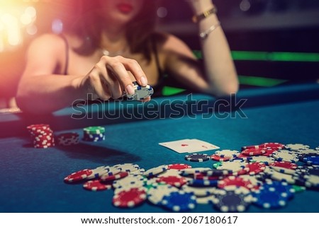 woman play poker game and doing bet, casino. gambling concept