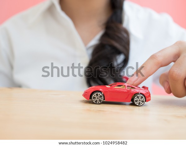 woman play toy
car