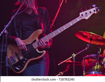 Woman Playing Bass Guitar