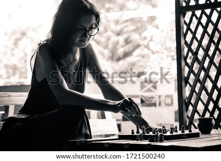 Similar – lifestyle shot of smart kid girl playing checkers at home