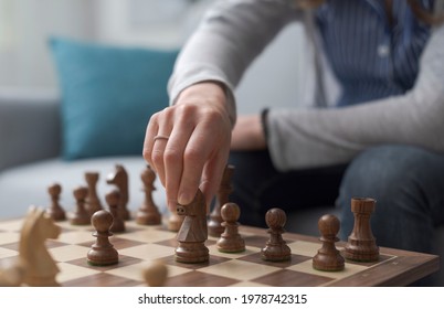 Woman Playing Chess, She Is Moving A Piece, Hand Close Up