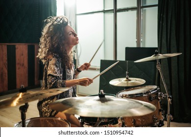 Woman Playing Drums During Music Band Rehearsal