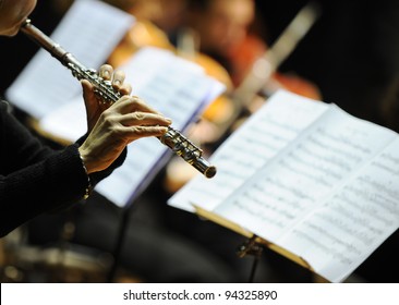 Woman Playing Flute During A Classical Concert Music