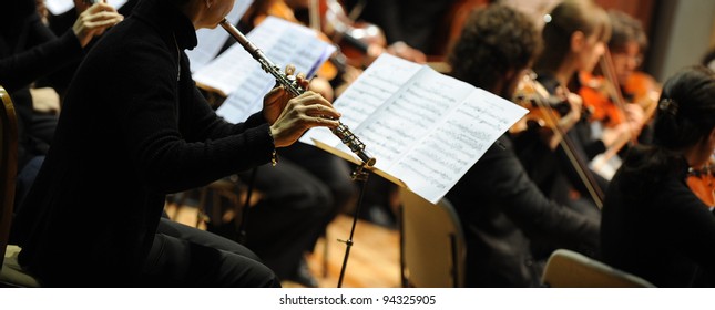 Woman Playing Flute During A Classical Concert Music