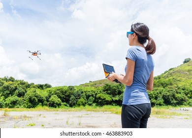 Woman Playing With Flying Drone