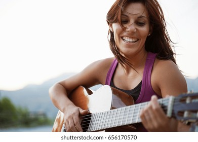 Woman Playing Guitar