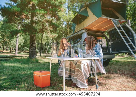 Similar – Image, Stock Photo Young women looking road map with vehicle on background