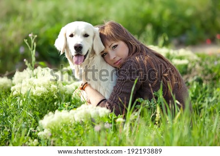 Similar – Pretty blond woman with her two dogs