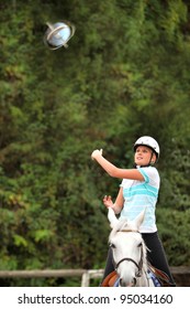 Woman Playing Horseball