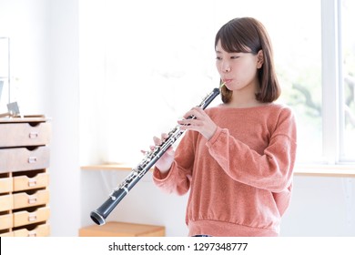 A Woman Playing Oboe