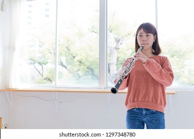 A Woman Playing Oboe