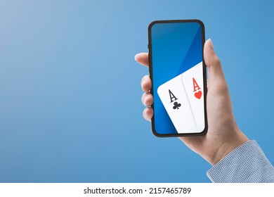 Woman Playing Poker Online On Her Smartphone, Casino And Online Gambling Games Concept