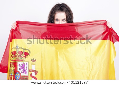 Woman playing with a spanish flag, hiding behind. She is a Spain team supporter!. Actual flag, no add ons. 