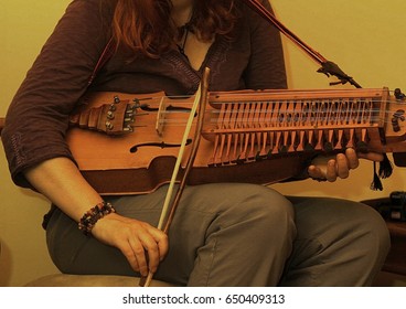 Woman Playing A Swedish Nyckelharpa