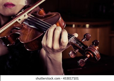 Woman Playing The Violin