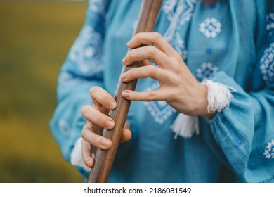 Woman Playing Woodwind Wooden Flute - Ukrainian Sopilka Outdoors. Folk Music, Culture Concept. Musical Instrument. Lady In Traditional Embroidered Shirt - Blue Vyshyvanka.