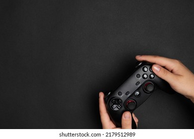 Woman Plays Video Games With The Console. Hands With Game Pad Isolated On Colorful Background. Gaming Concept.
