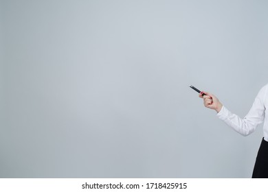 Woman Pointing To Blank Copy Space Screen With Arm Hand And Laser Pointer In Shot