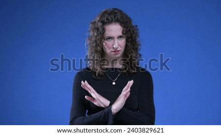 Woman pointing to camera expressing 