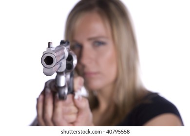 A Woman Pointing A Gun With A Serious Look On Her Face.