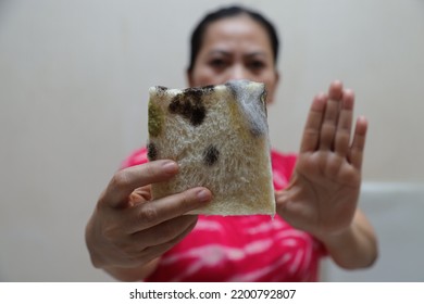 Woman Pointing To Rotten Food. Moldy Bread, Unhealthy Food