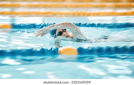 Woman, pool and swimming in sports fitness, exercise or training in water splash or athletics. Female person, athlete or professional swimmer in competition, race or marathon in workout practice - Powered by Shutterstock