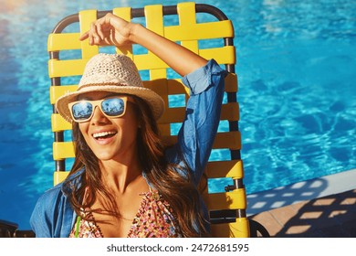 Woman, poolside and lying on holiday chair, outdoor and travel to hotel resort for vacation. Female person, peace and sunglasses by water to rest, smile and calm by swimming pool for luxury wellness - Powered by Shutterstock