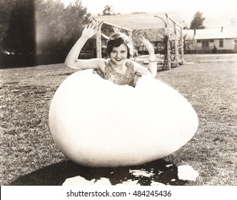 Woman Popping Out Of Giant Egg