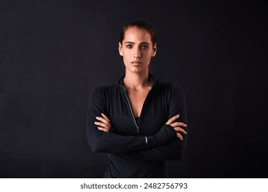 Woman, portrait and crossed arms in studio for fitness, health and workout on black background. Female athlete, face and confidence for crossfit, wellness or performance training at sport competition - Powered by Shutterstock