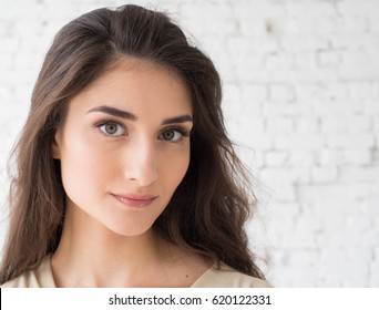 Woman Portrait Natural Beautiful Casual Beautiful People. Studio Shot. Stone Wall Background.