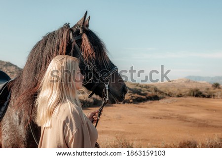 Similar – Image, Stock Photo Portrait of adult woman with beautiful horse in nature. Sunlight, silhouette.Concept of love for lesser brothers, caring and animal training