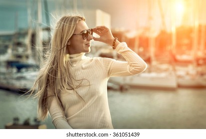 Woman portrait on the yacht background under sunlight.