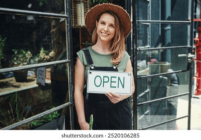 Woman, portrait and open sign at plant store, small business and owner for organic nursery at entrance. Female person, retail manager and board in window for service, professional and pride in Canada - Powered by Shutterstock