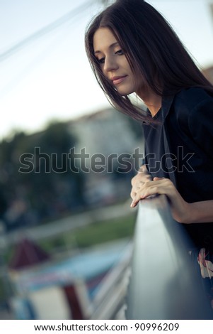 Similar – Woman looking from her balcony the city