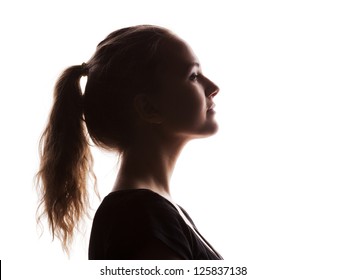  woman portrait profile  in silhouette shadow on studio isolated white background