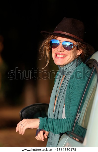 woman\
portrait with smiling expression in the\
sunlight